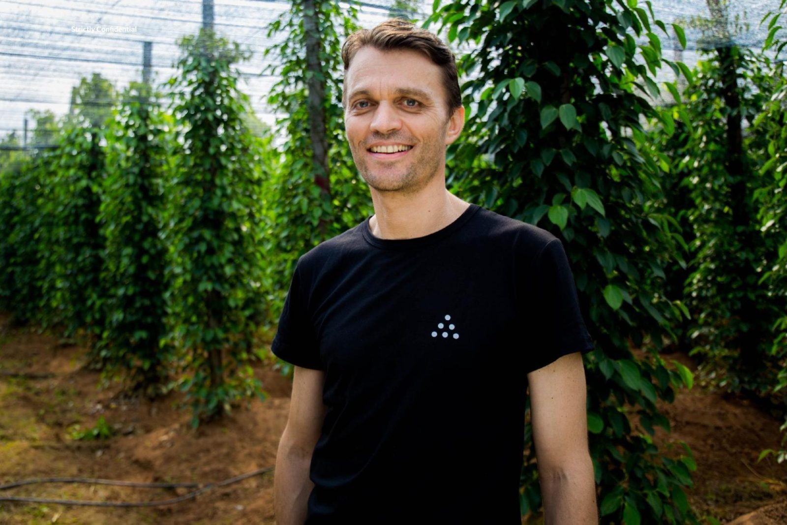 Frédéric Fretard, co-founder and chief financial officer, holding a basket of fresh pepper